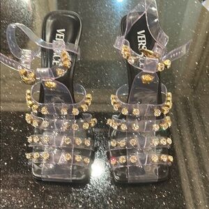Versace clear pvc sandals with gold rhinestone details and black heels